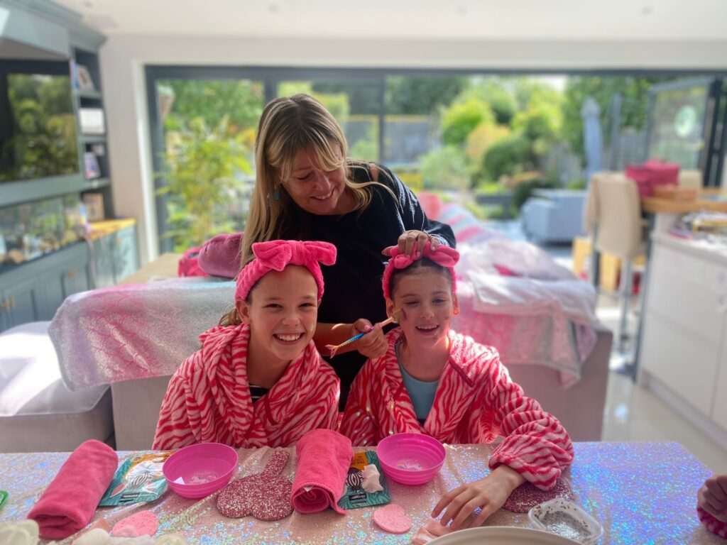 Jane giving the two girls a makeover.